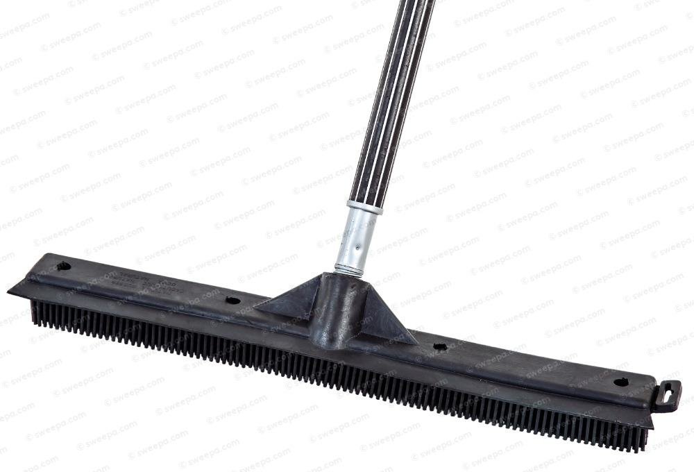 A wide natural rubber industrial broom with a long handle